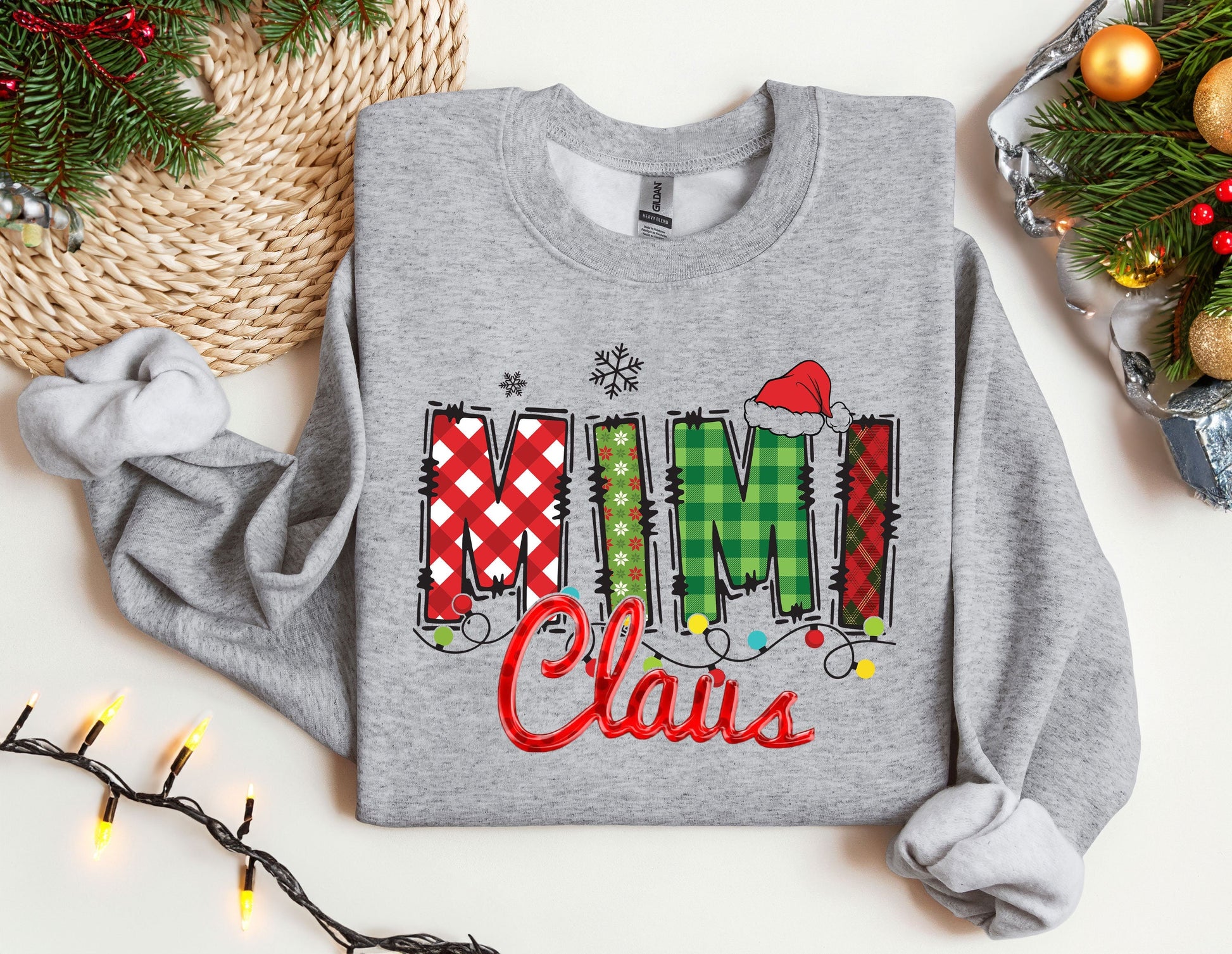 a christmas sweater with the word mimi claus on it