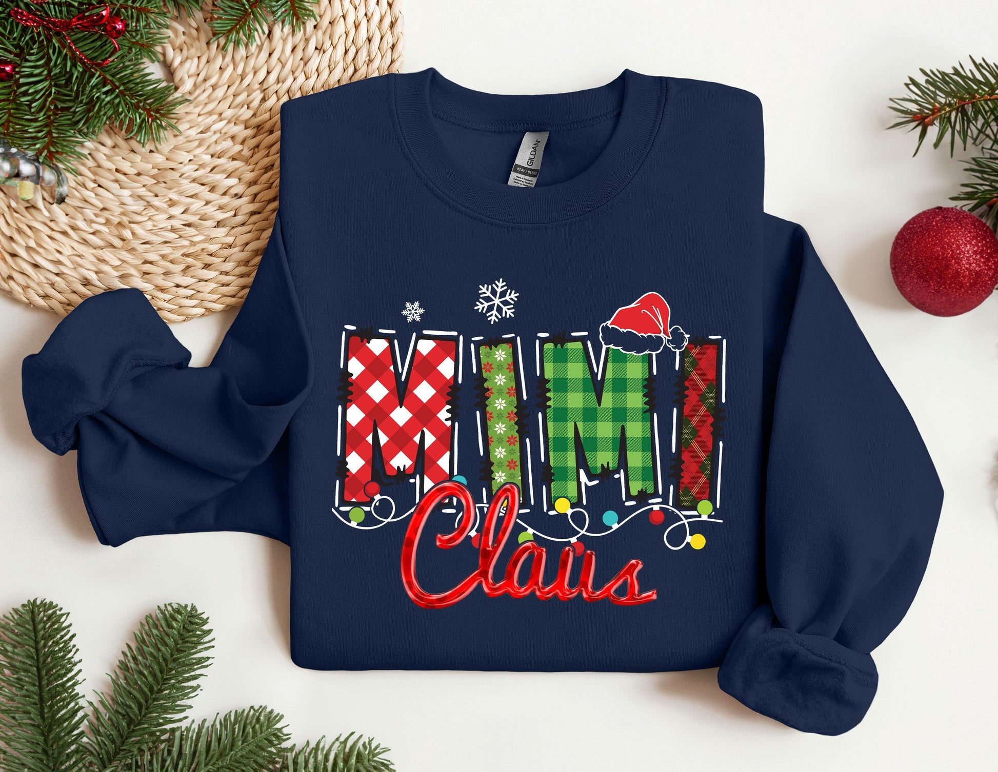 a christmas sweater with the word mimi claus on it