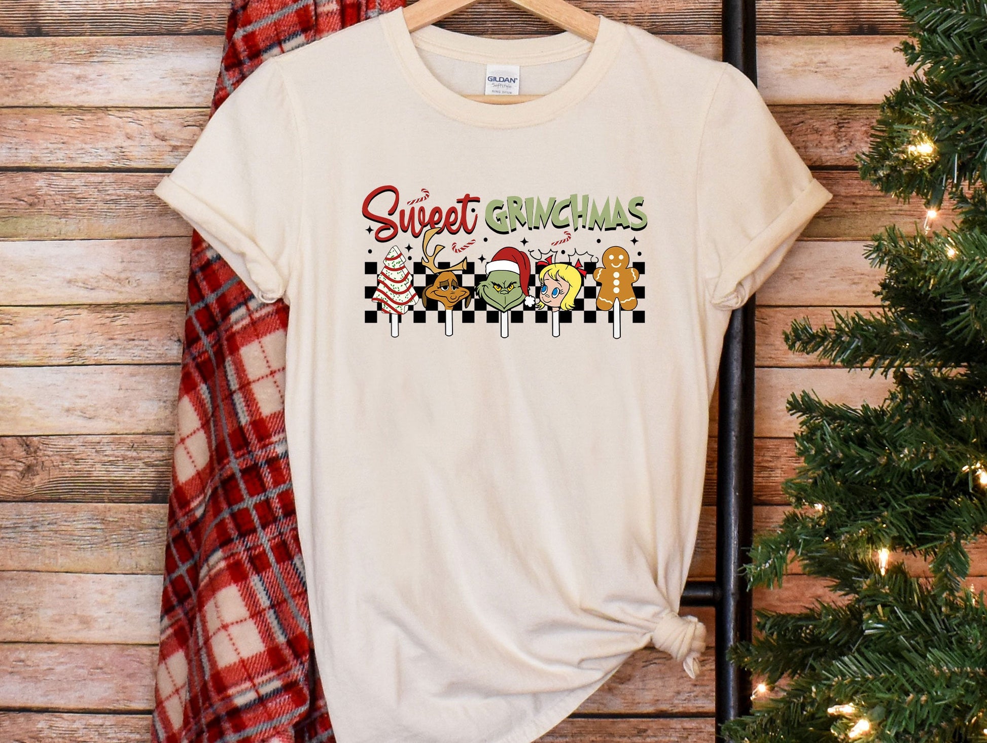 a t - shirt with the words sweet christmas on it