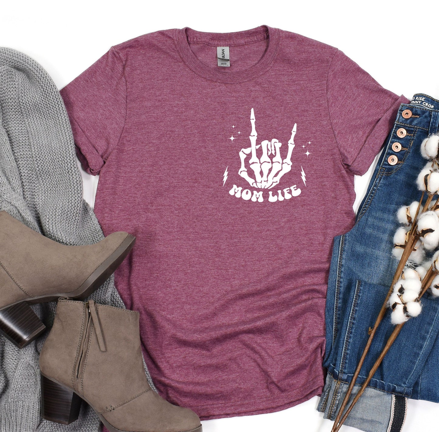 a t - shirt with the words moon rules on it next to a pair of