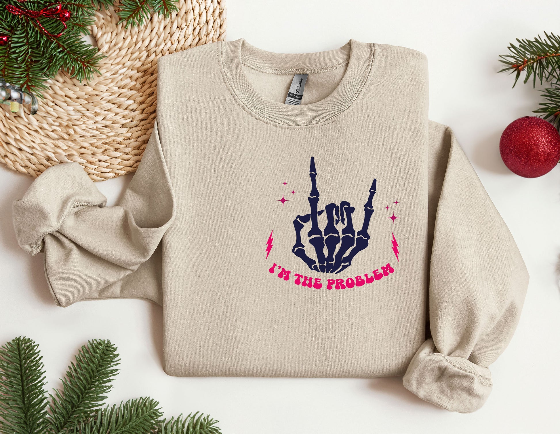 a sweater with a picture of a hand holding two fingers