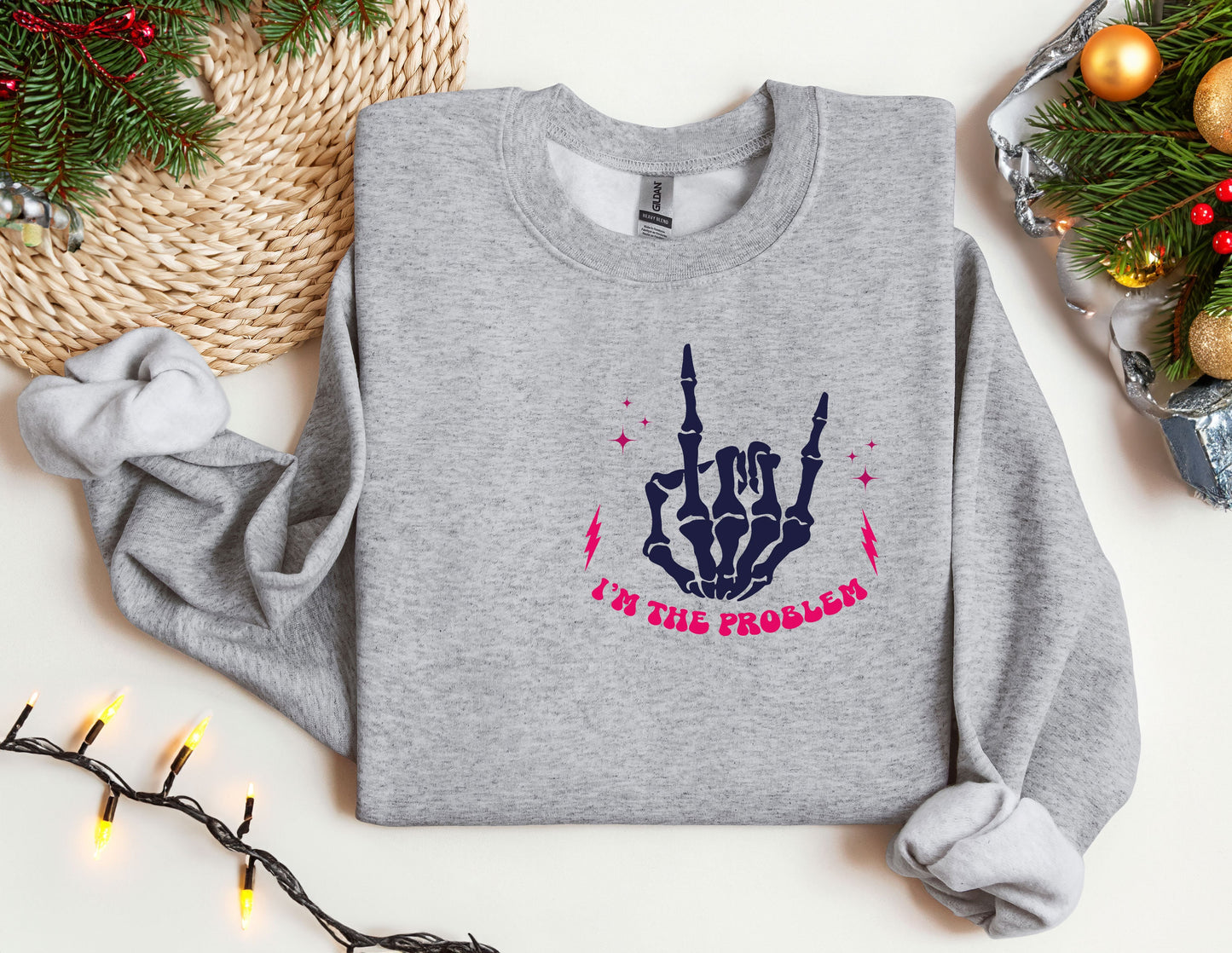 a grey sweatshirt with a pink and blue design on it