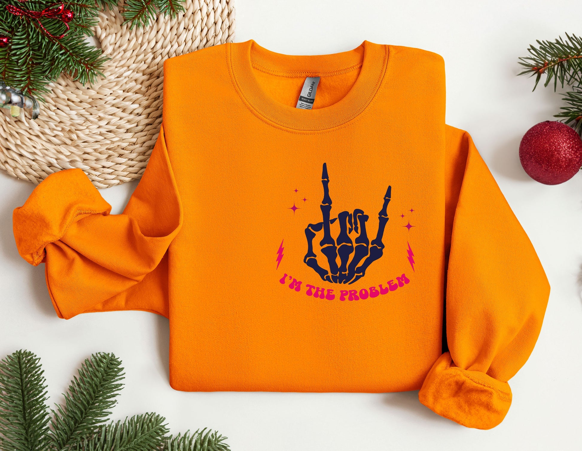 an orange sweatshirt with a hand print on it