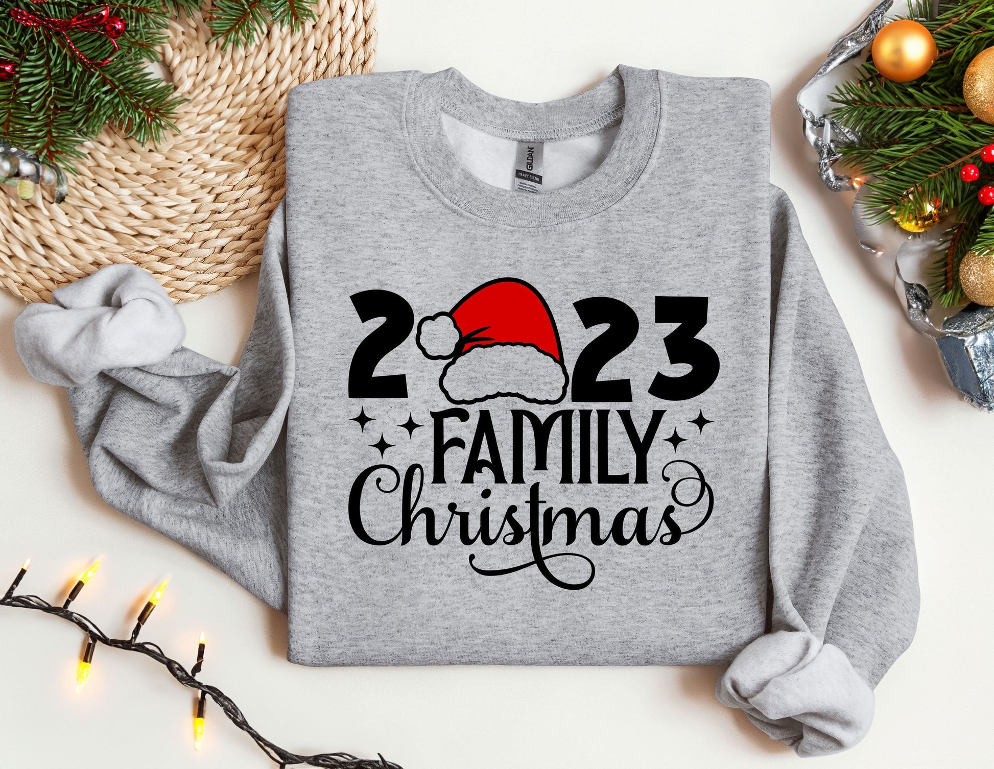 a gray sweatshirt with a santa hat on it