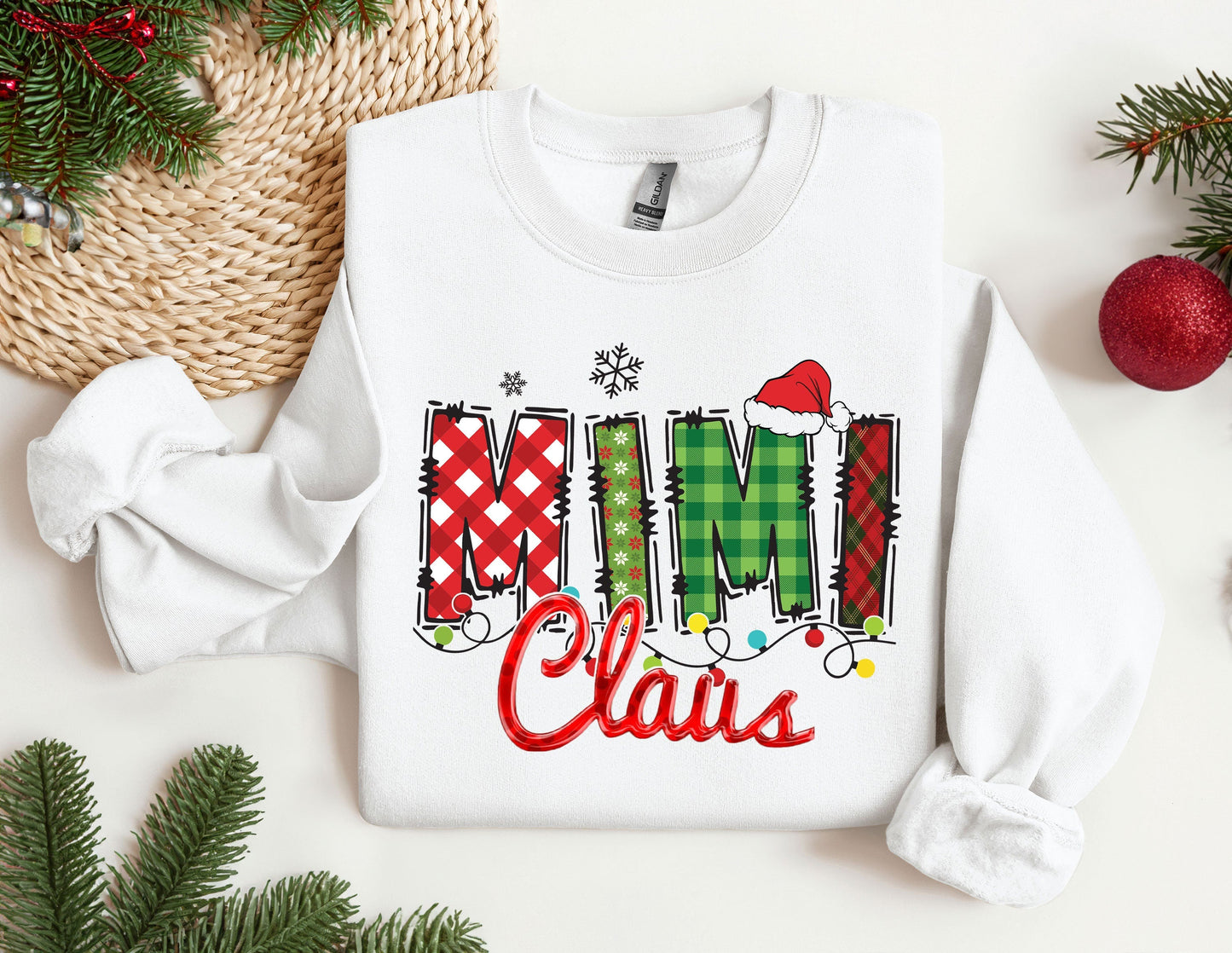 a white sweatshirt with the word mimi claus printed on it