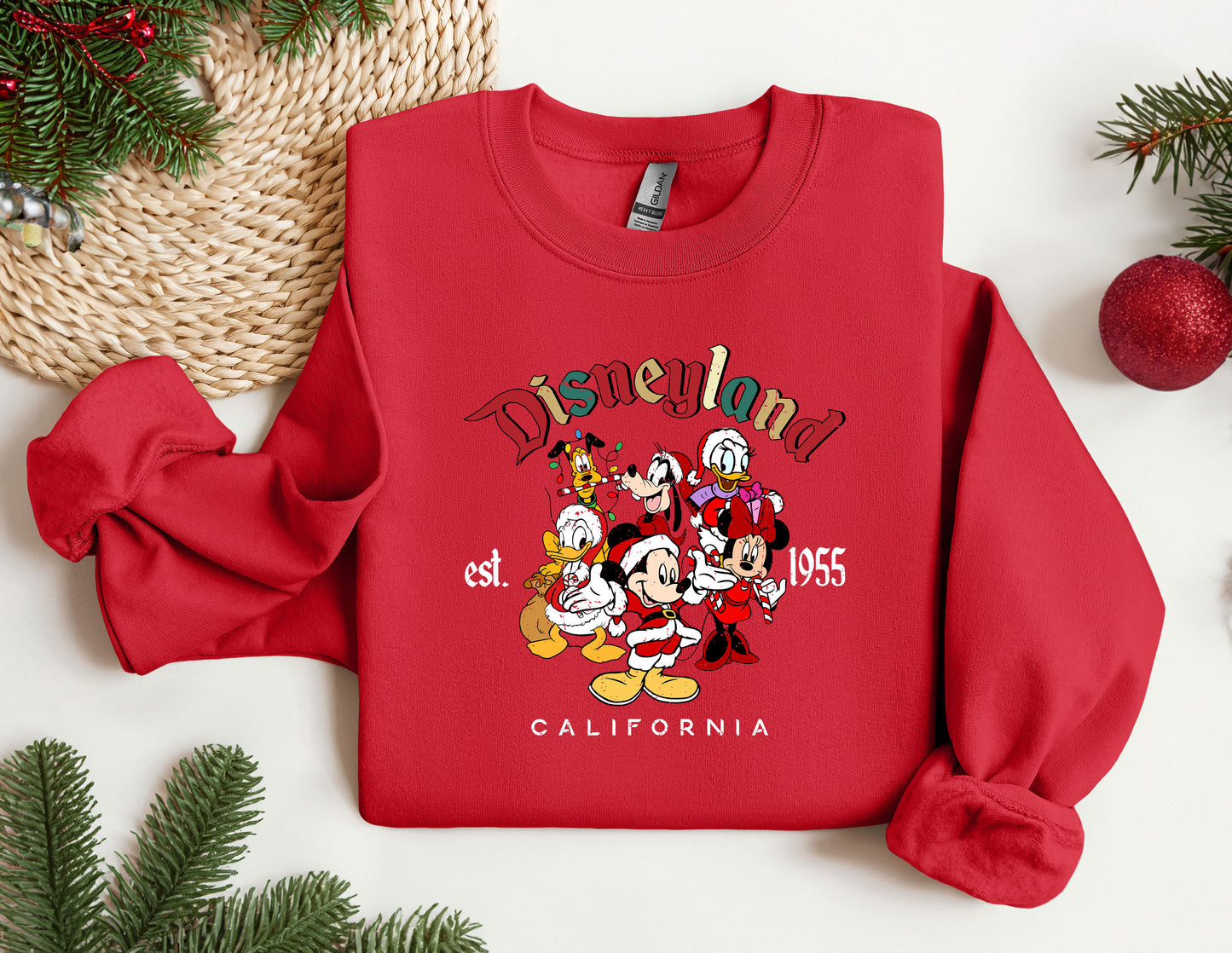 a red sweatshirt with a group of cartoon characters on it