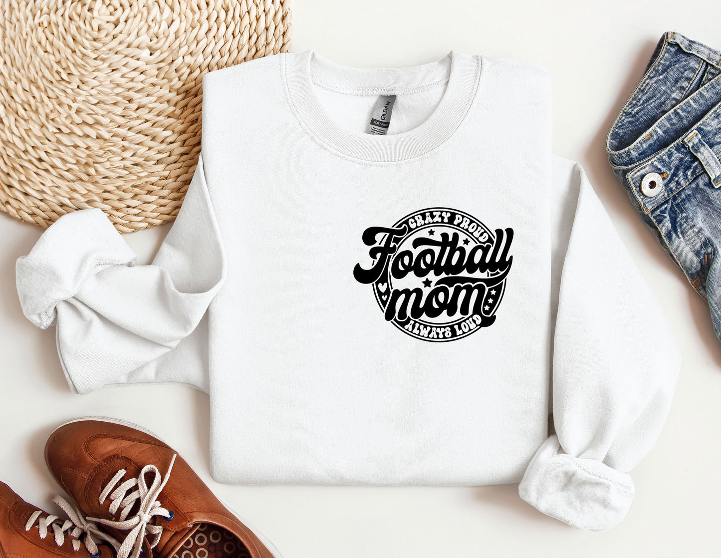 a white sweatshirt with the words football mom on it